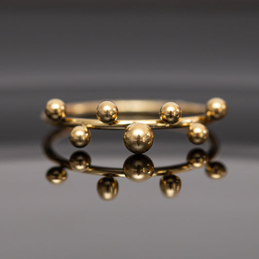 Bague acier dorée fine avec 7 boules tendance