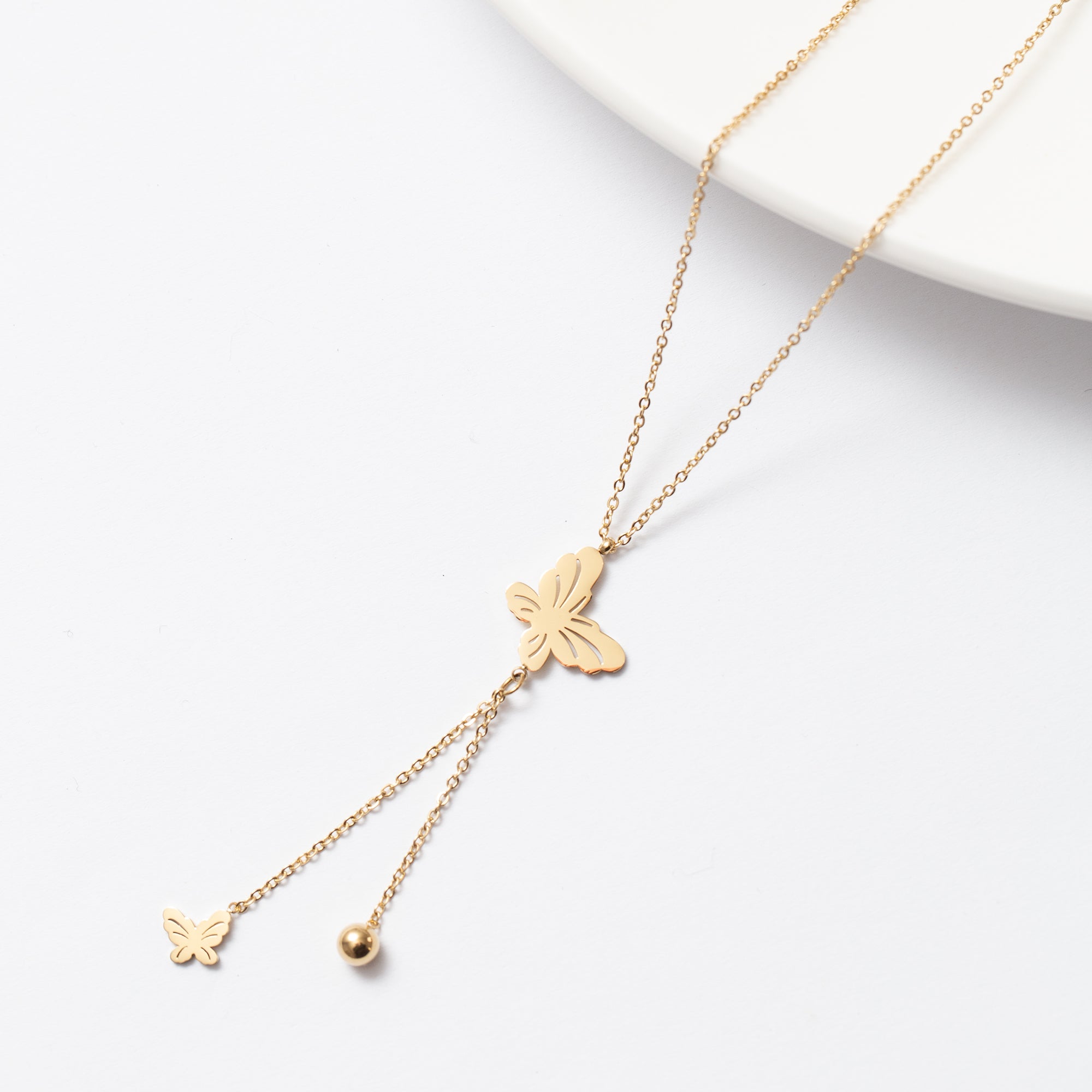 Collier Acier doré tendance avec un 2 motifs papillons