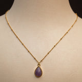 Collier en acier en promotion avec pierre améthyste.