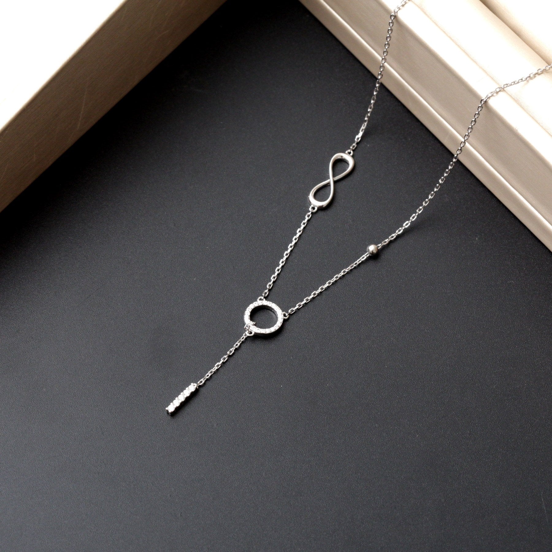 Collier argent Rhodié Garanti  rond infinity cravate